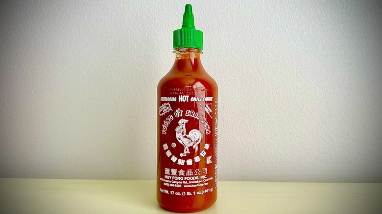An unopened bottle of Hoy Fung Sriracha