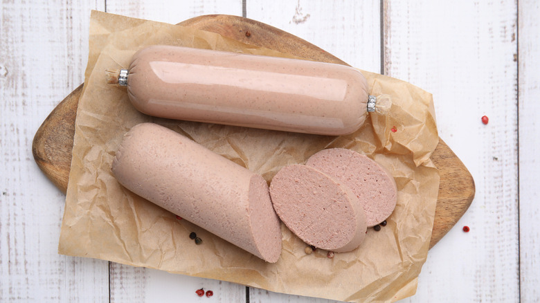 board with sliced liver sausage