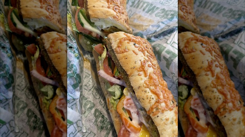 Veggie patty sub close up in Subway packaging, mirrored image