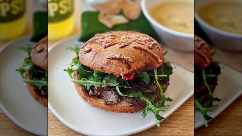 Panera Spicy Steak Asiago Bagel Stack sandwich on white plate