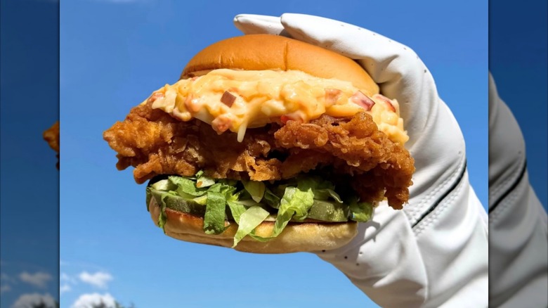 Shake Shack Clubhouse Pimento Cheese Chicken Sandwich sitting on tray with paper liner