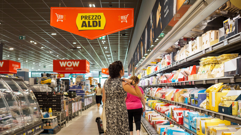 Customers walking through the aisles of an ALDI supermarket