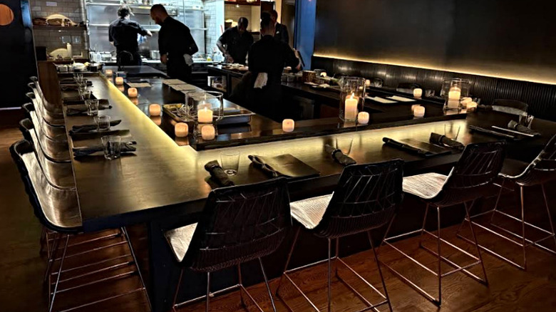 Staff preparing dinner at the chef's counter at Beckon