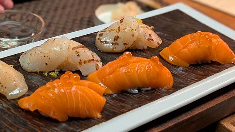 Plated salmon and scallop nigiri