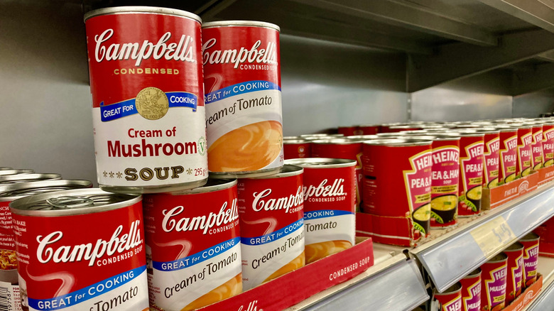 Campbell's cream of mushroom and cream of tomato soup on store shelves
