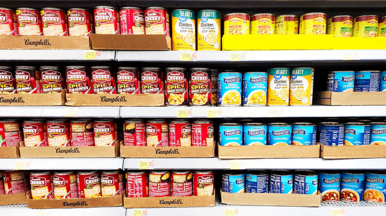 a variety of canned soups on store shelves