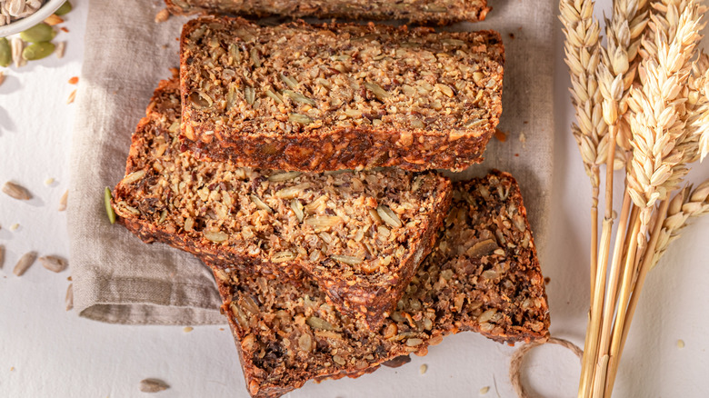 seeded Graham Bread slices next to wheat