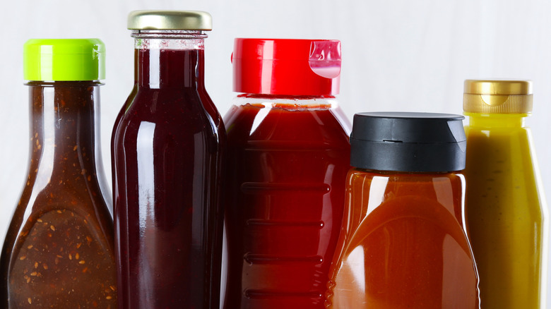 Variety of different ketchup condiment bottles