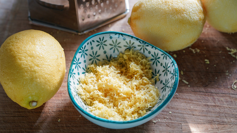 Finely grated lemon rind in bowl