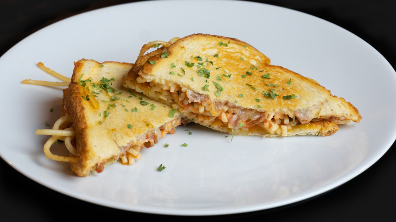 Spaghetti sandwich on buttered white bread