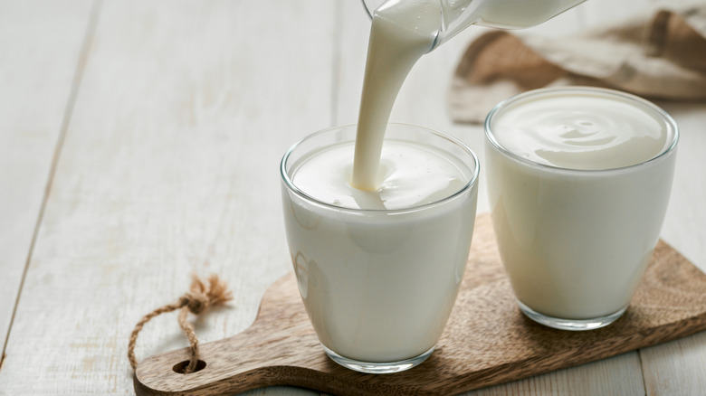 pouring buttermilk into a glass