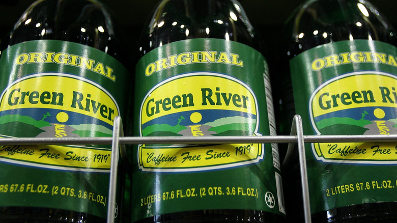 Bottles of Green River soda lie on display at a market