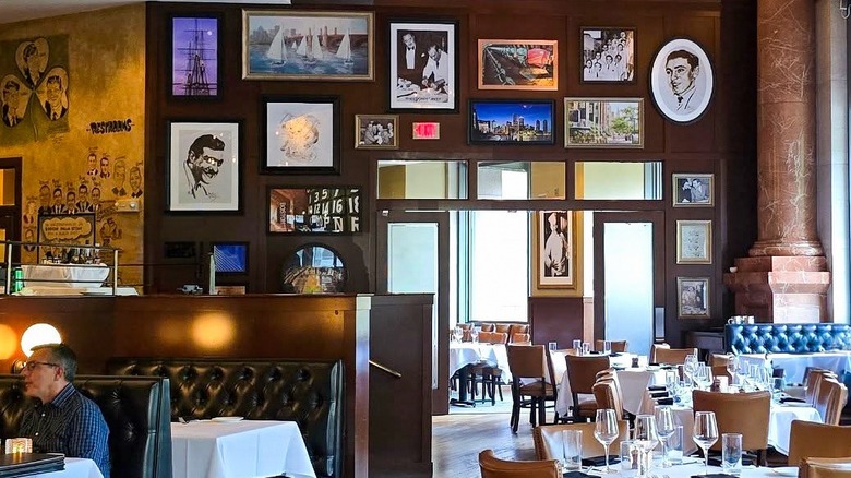 A person eating in the opulent interior of a Palm Restaurant