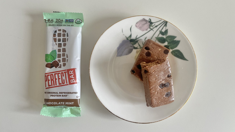 Chocolate Mint Perfect Bar on a plate next to the wrapper