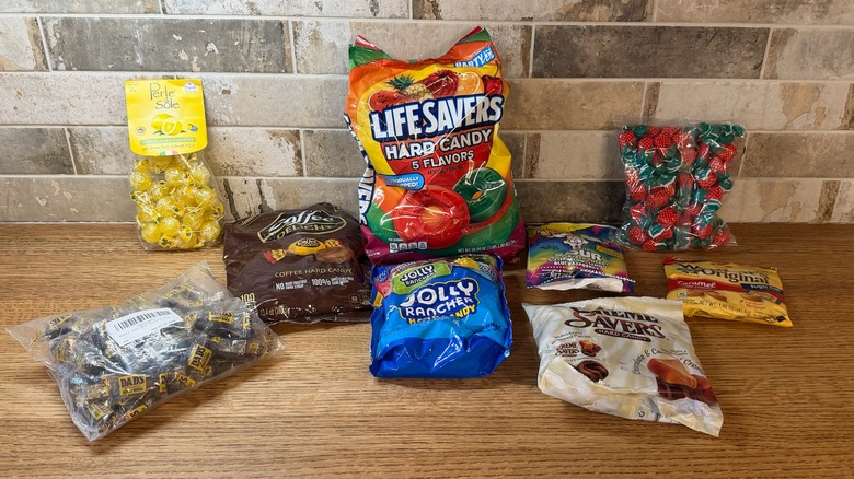 Multiple bags of hard candy on table
