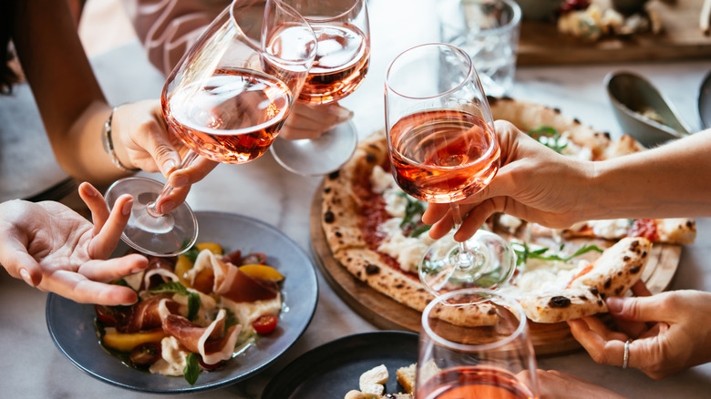 Friends meeting up for Italian dishes and wine