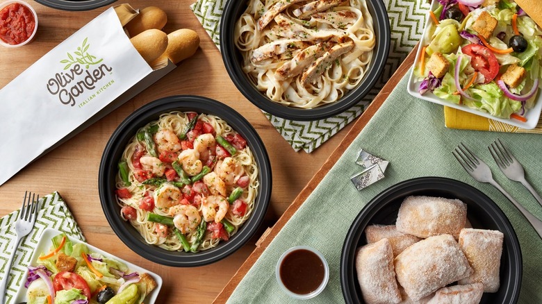 Olive Garden's shrimp pasta, Italian salad, and breadsticks