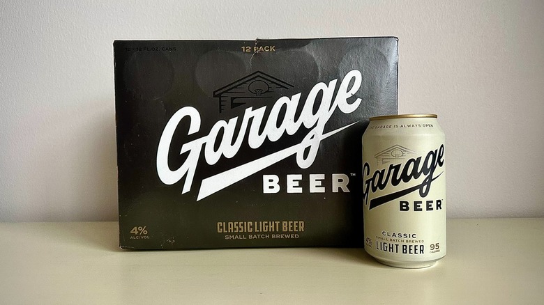 The front of a can of Garage Beer, next to the box of a 12 pack