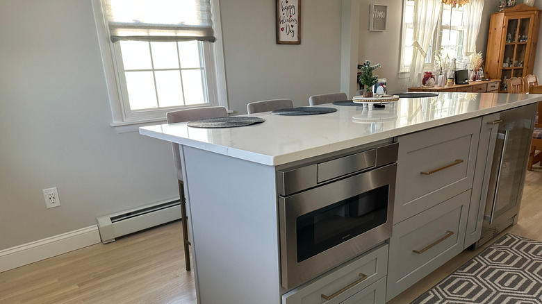 Kitchen island with white quartz countertops