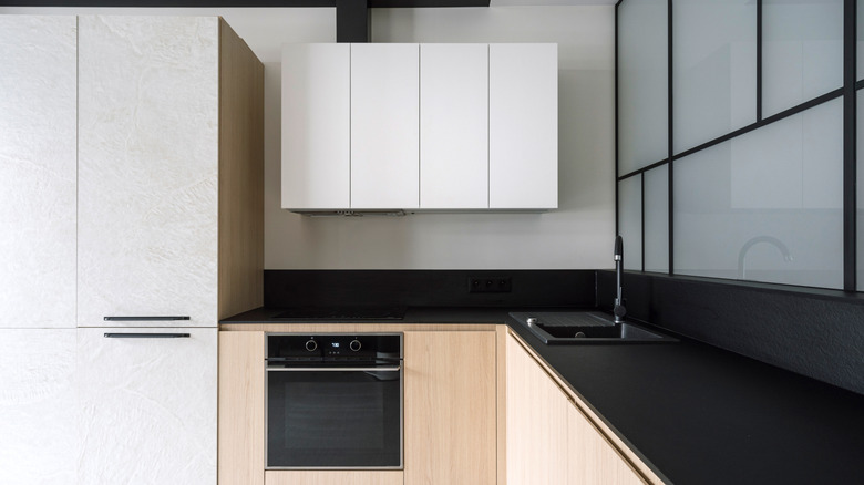 Black quartz countertop in modern looking kitchen