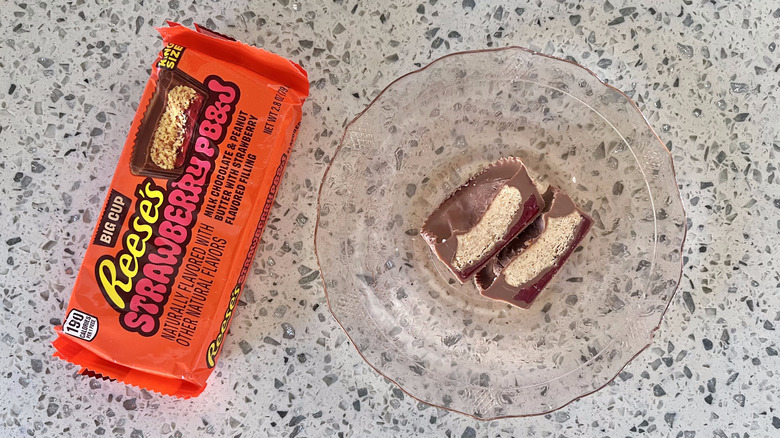 A piece of Strawberry PBJ Big Cup Reese's on a plate