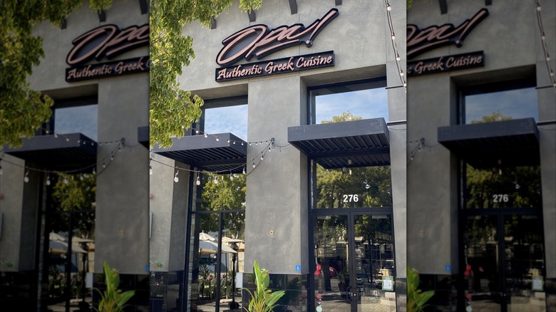 front of an Opa Authentic Greek Cuisine restaurant