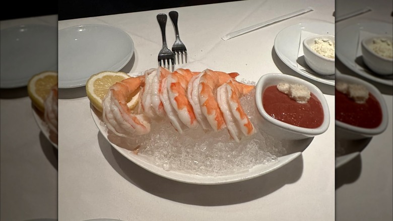 Colossal shrimp with cocktail sauce on table at Fleming's Prime Steakhouse & Wine Bar