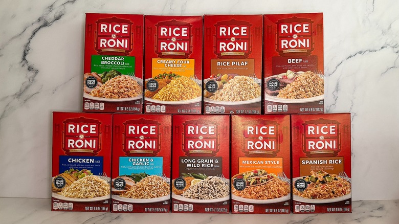 Nine boxes of Rice-a-Roni stacked on marble surface