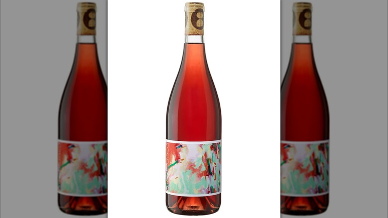Bottle of deep Ruby Blanca rosé wine against white background