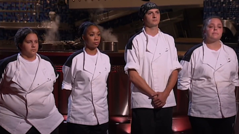 Contestants in the kitchen lined up for elimination on Hell's Kitchen