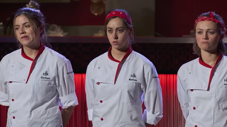 Three Hell's Kitchen contestants lined up in chef whites