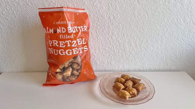 Almond butter, pretzel nugget pieces on a plate