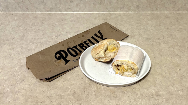 Potbelly chicken club sandwich on white plate and neutral background.