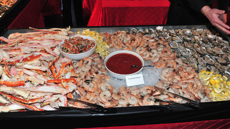 Seafood buffet with bowl of cocktail sauce