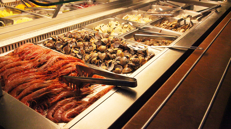 Seafood buffet with tongs