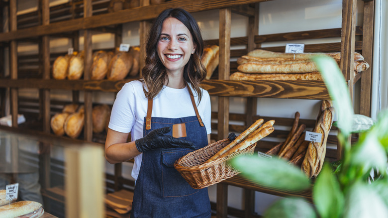 friendly bakery staff with baguette basket