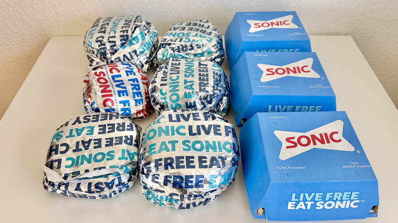 Various Sonic burgers on a table