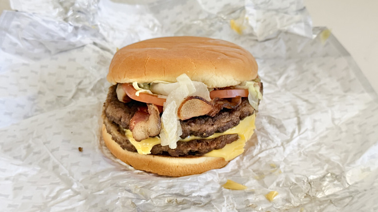 Side view of a SuperSONIC Bacon Double Cheeseburger