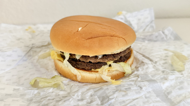 SuperSONIC Jalapeño Double Cheeseburger with lettuce falling out