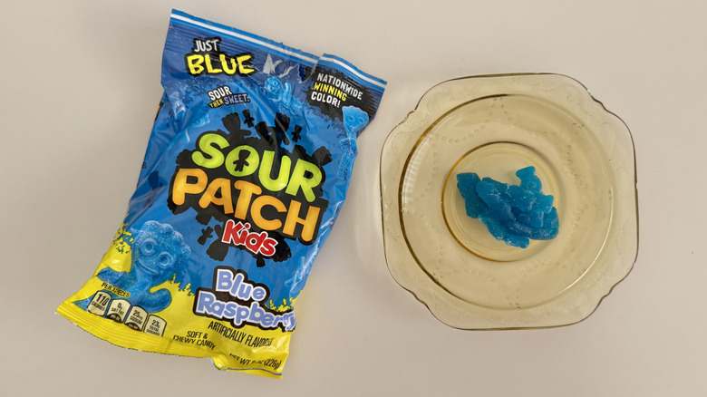 Blue Raspberry Sour Patch Kids stuck together on a plate