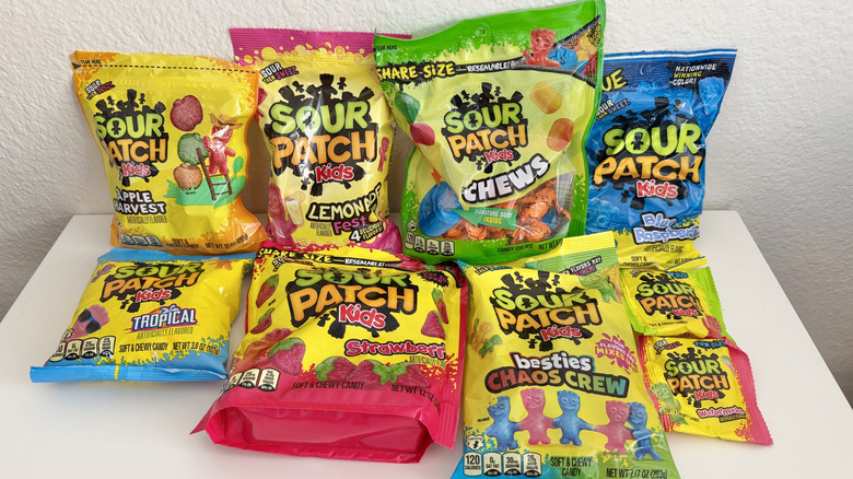 Table with various Sour Patch Kids bags