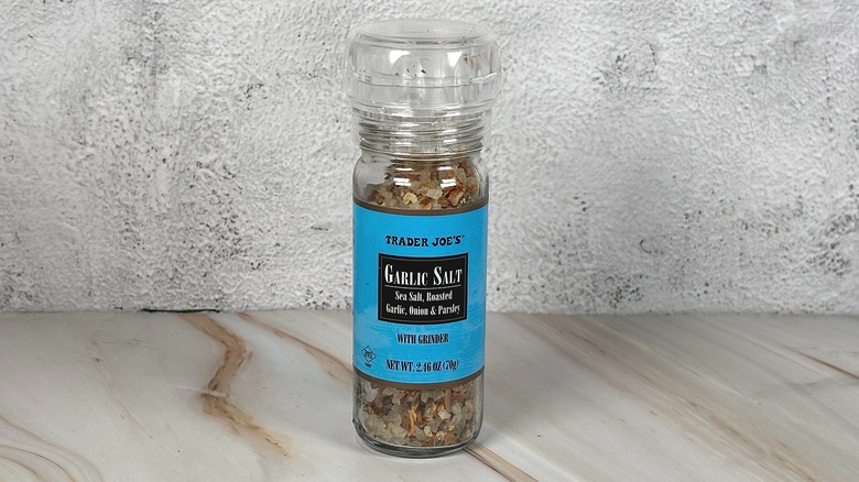 Container of Trader Joe's garlic salt on table