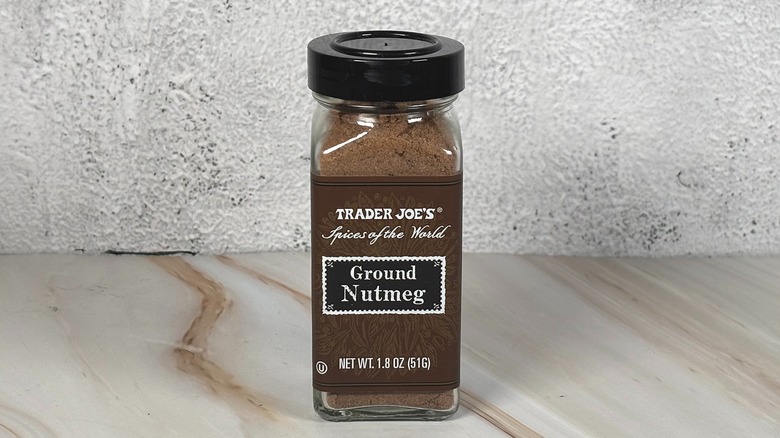Container of Trader Joe's ground nutmeg on table