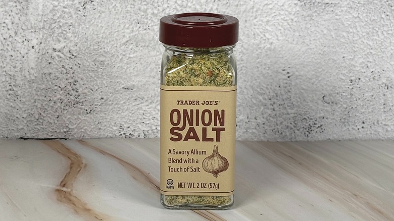 Container of Trader Joe's onion salt on table