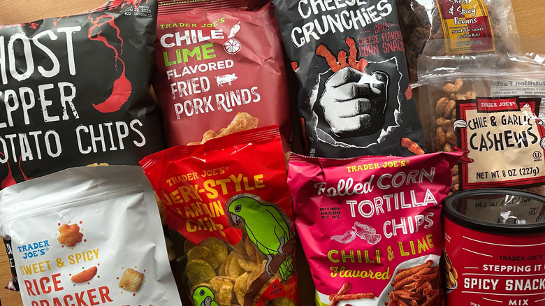 Variety of spicy snacks from Trader Joe's on wooden table