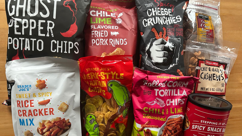 Variety of spicy snacks from Trader Joe's on wooden table