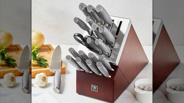 Henckels Modernist 20-piece self-sharpening knife block set on kitchen countertop near cutting board