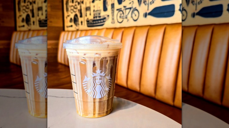 Starbucks Pumpkin Cold Brew in plastic branded cup on table