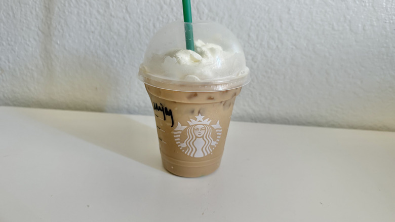Iced Cinnamon Toast Crunch Latte with whipped cream on top