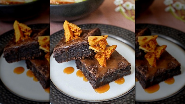 Fleming's Steakhouse chocolate gooey brownie dessert on plate.